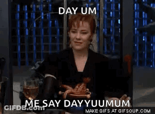 Woman Sitting At Table With Plate Of Food And Wine GIF