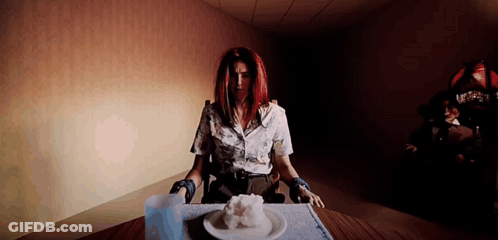 Woman Sitting At Table With Plate Of Food GIF