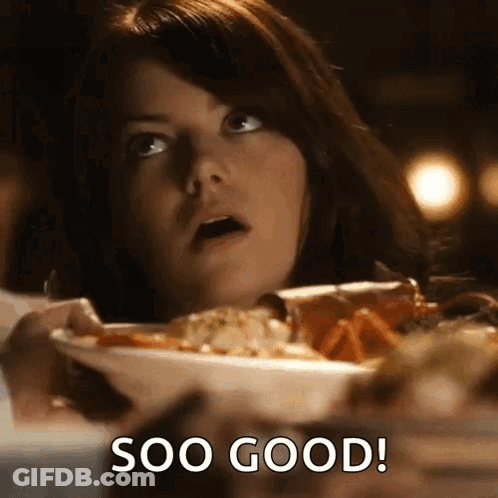 Woman Sitting At Table With Soo Good Food GIF