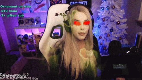 Woman Sitting By White Christmas Tree With Call Of Duty Shirt GIF