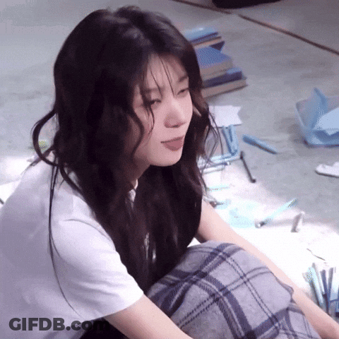 Woman Sitting Cross-Legged With Tongue Out GIF