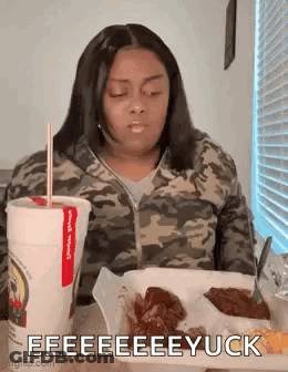 Woman Sitting Eating And Drinking GIF
