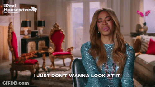 Woman Sitting Eyes Closed Saying I Just Don't Wanna Look At It GIF