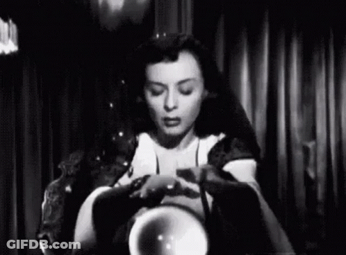 Woman Sitting Holding Crystal Ball GIF