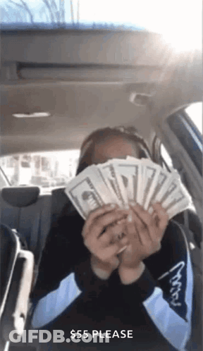 Woman Sitting In Back Seat Holding Fan Of Money GIF