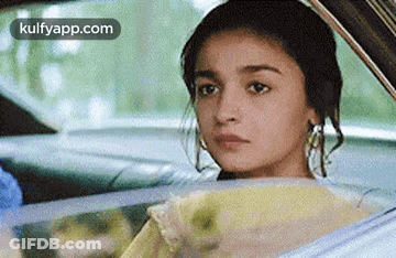 Woman Sitting In Car Looking Out Window GIF