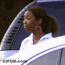 Woman Sitting In Car Looking Out Window GIF