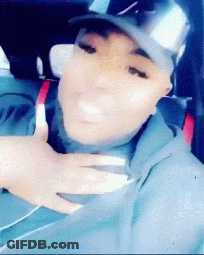 Woman Sitting In Car With Hat And Hoodie GIF