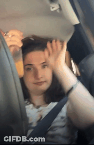 Woman Sitting In Car With Orange Juice GIF