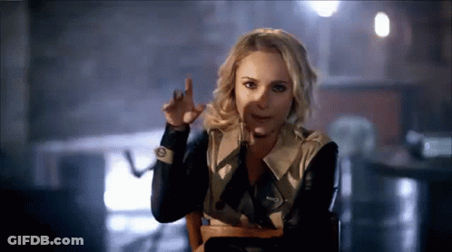 Woman Sitting In Chair Funny Face With Finger GIF