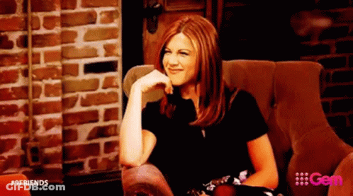 Woman Sitting In Chair Hand On Chin Brick Wall Background GIF