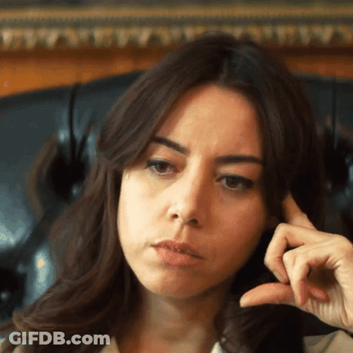 Woman Sitting In Chair Hand On Face GIF