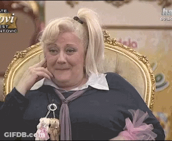 Woman Sitting In Chair Hand On Face Ovi Sign GIF