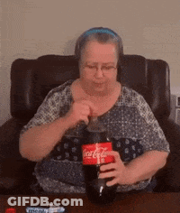 Woman Sitting In Chair Holding Coca Cola GIF