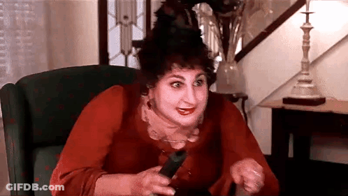 Woman Sitting In Chair Holding Remote GIF