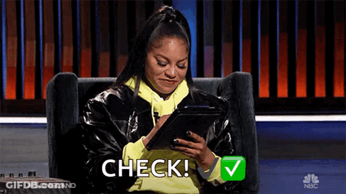 Woman Sitting In Chair Holding Tablet And Check Emoji GIF