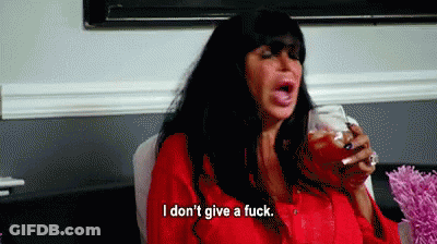 Woman Sitting In Chair Holding Wine Saying I Don't Give A Fuck GIF