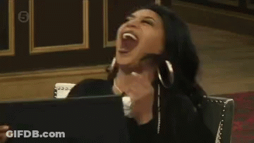 Woman Sitting In Chair Laughing GIF