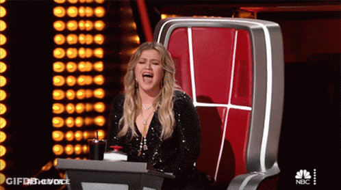 Woman Sitting In Chair Mouth Open NBC Logo GIF