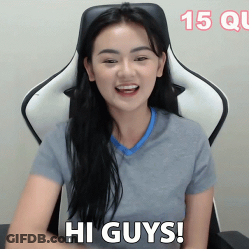 Woman Sitting In Chair Saying Hi Guys GIF