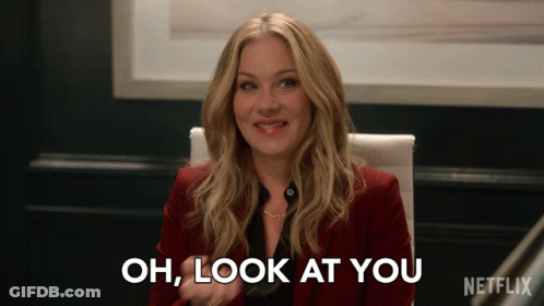 Woman Sitting In Chair Saying Oh Look At You GIF