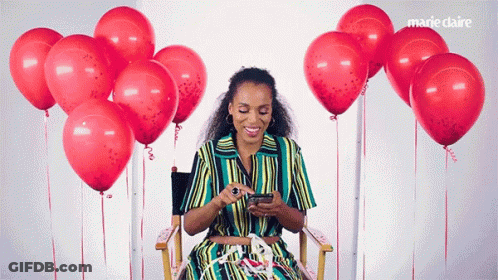 Woman Sitting In Chair Surrounded By Red Balloons Marie Claire GIF