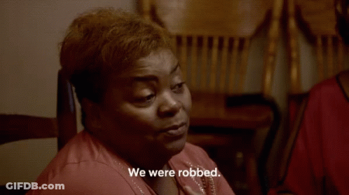 Woman Sitting In Chair We Were Robbed GIF