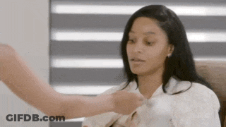 Woman Sitting In Chair While Man Holds Her Shirt GIF