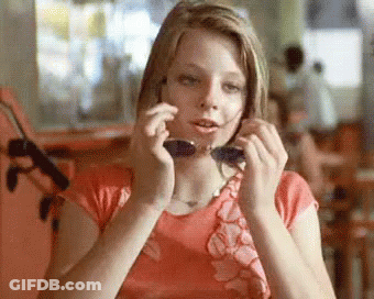 Woman Sitting In Chair With Bet Logo GIF