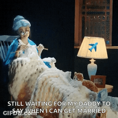 Woman Sitting In Chair With Blanket And Airplane Lamp GIF