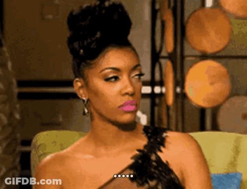 Woman Sitting In Chair With Bun GIF