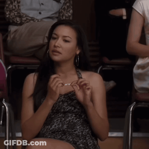 Woman Sitting In Chair With Crossed Legs GIF