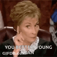 Woman Sitting In Chair With Hand On Chin GIF