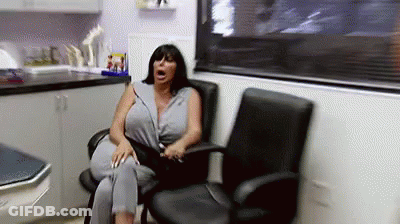 Woman Sitting In Chair With Mouth Open GIF