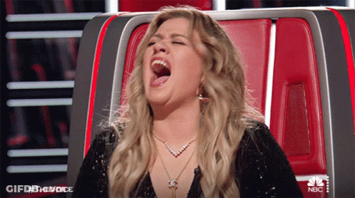 Woman Sitting In Chair With Mouth Open GIF