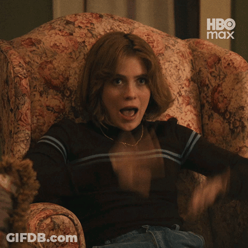 Woman Sitting In Chair With Mouth Open GIF