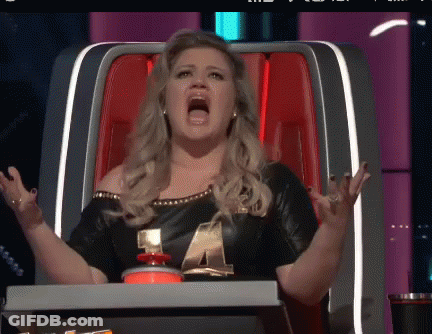 Woman Sitting In Chair With Mouth Wide Open GIF