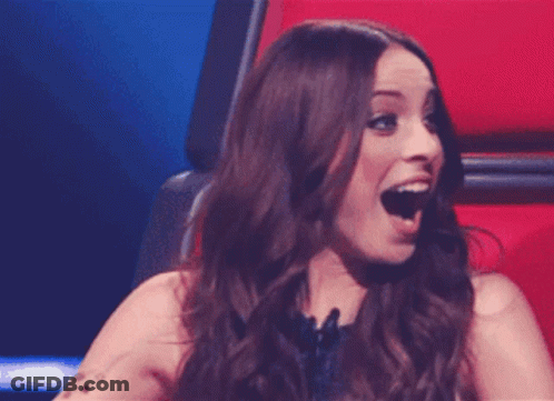 Woman Sitting In Chair With Mouth Wide Open GIF