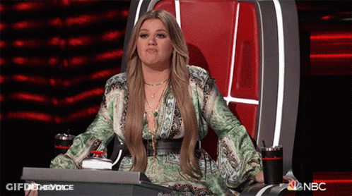 Woman Sitting In Chair With NBC Logo GIF