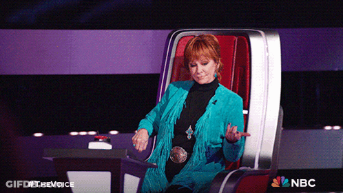 Woman Sitting In Chair With NBC Logo GIF