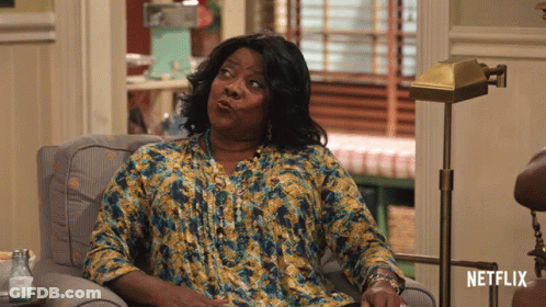 Woman Sitting In Chair With Netflix Logo GIF