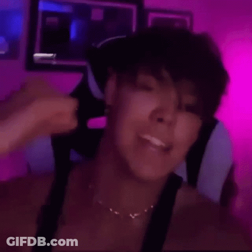 Woman Sitting In Chair With Pink Wall GIF