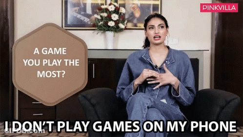Woman Sitting In Chair With Pinkvilla Logo GIF