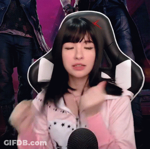 Woman Sitting In Chair With Red X On Back GIF