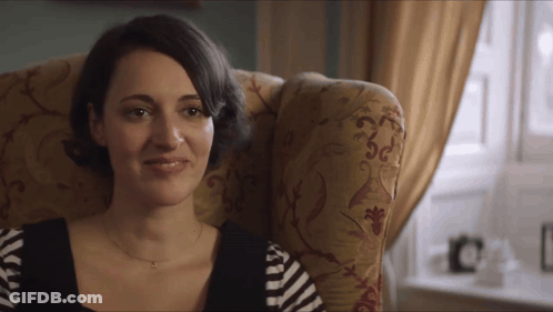 Woman Sitting In Chair With Striped Shirt GIF