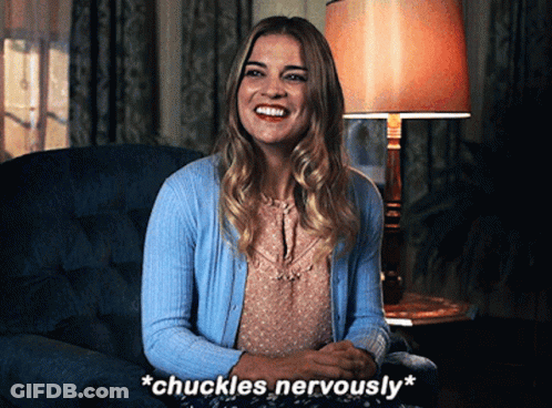 Woman Sitting In Chair With Words Chuckles Nervously GIF