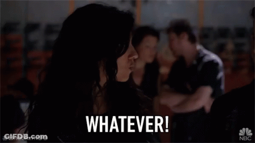 Woman Sitting In Dark Room Saying Whatever GIF