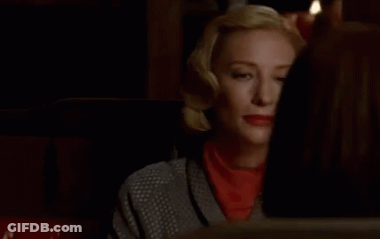 Woman Sitting In Dark Room Says Yes GIF