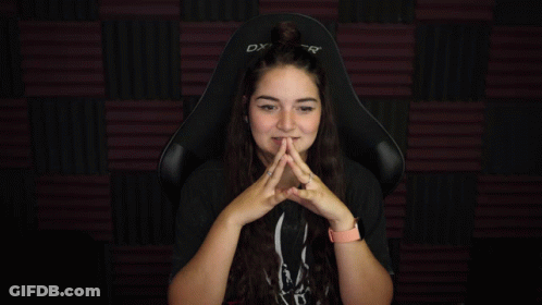 Woman Sitting In DX Gaming Chair With Hands Up GIF
