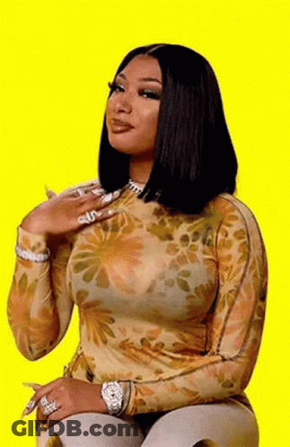 Woman Sitting In Floral Top And Watch GIF